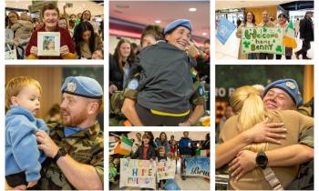 PICTIÚIRÍ: Radharcanna mothúchánacha ag Aerfort Bhaile Átha Cliath agus beagnach 200 Síochánaí Éireannach ag filleadh abhaile