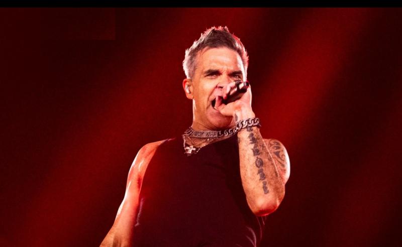Lig dom siamsaíocht a thabhairt duit! Deimhníonn Robbie Williams dáta Pháirc an Chrócaigh